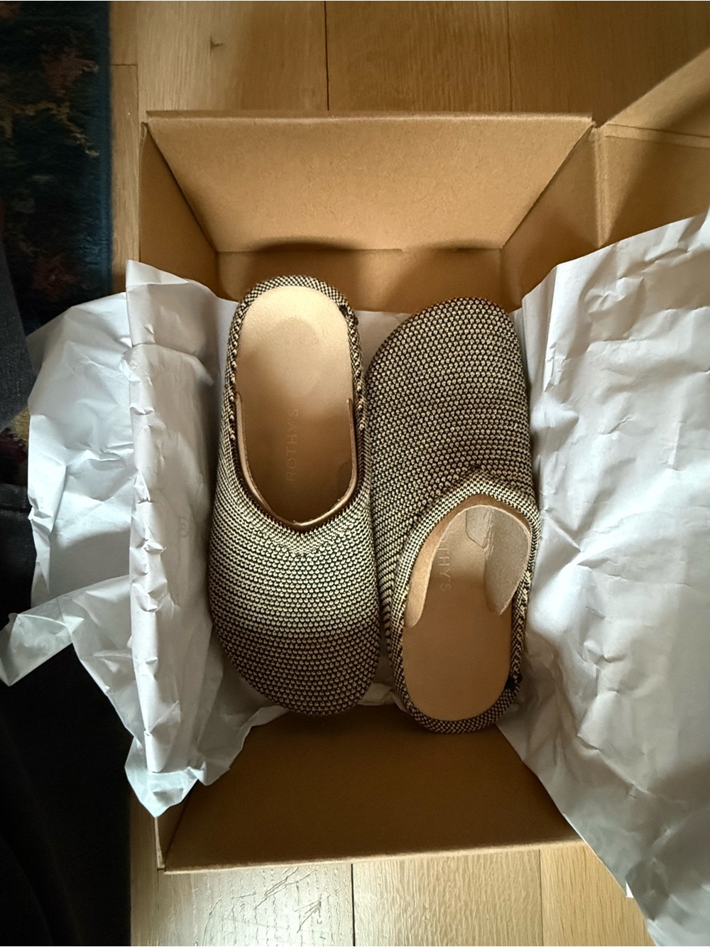 Rothy's Toffee Raffia Beige and Black Woven Slip-On Hemp Clog.